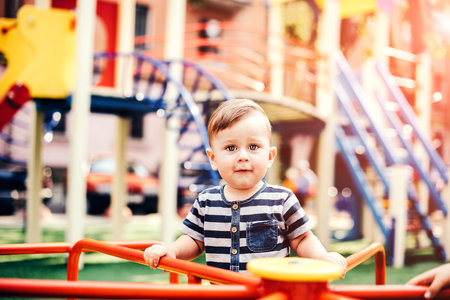 Pretty little baby playing outdoor in the parkの写真素材