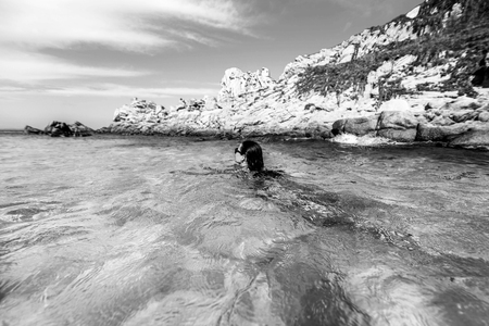 Pretty brunette girl relaxing in the waterの写真素材