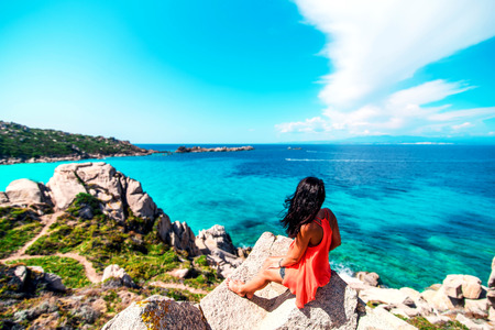 Young brunette girl relaxing near outdoor near seaの写真素材