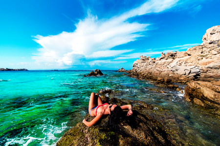Pretty brunette girl relaxing in the waterの写真素材