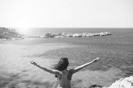Young brunette girl relaxing near outdoor near seaの写真素材