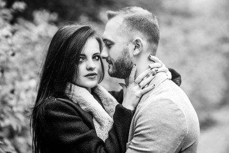 Happy couple walking outdoor in the parkの写真素材