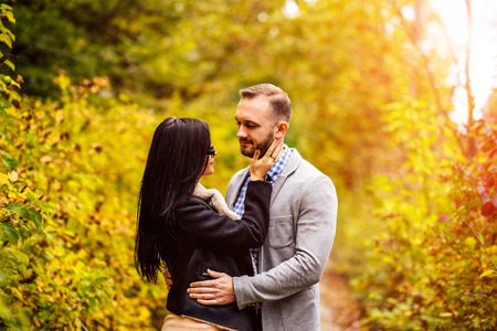 Happy couple walking outdoor in the parkの写真素材