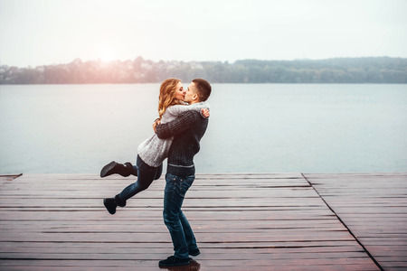 Young happy couple have fun outdoor in the parkの写真素材