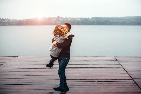 Young happy couple have fun outdoor in the parkの写真素材