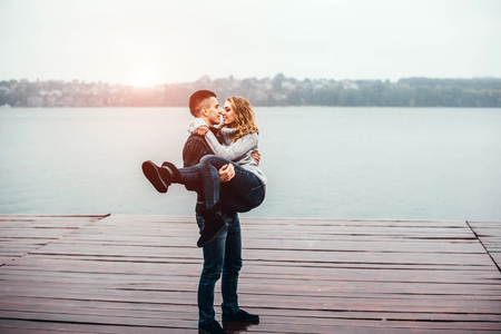 Young happy couple have fun outdoor in the parkの写真素材