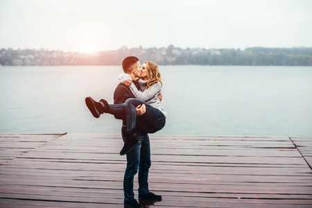 Young happy couple have fun outdoor in the parkの写真素材