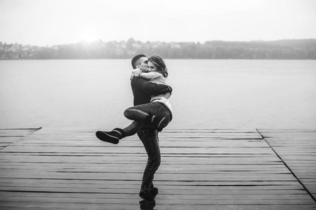 Young happy couple have fun outdoor in the parkの写真素材