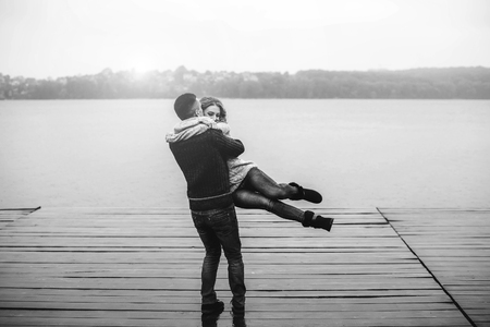 Young happy couple have fun outdoor in the parkの写真素材