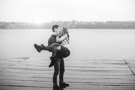 Young happy couple have fun outdoor in the parkの写真素材