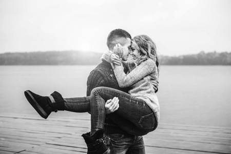 Young happy couple have fun outdoor in the parkの写真素材