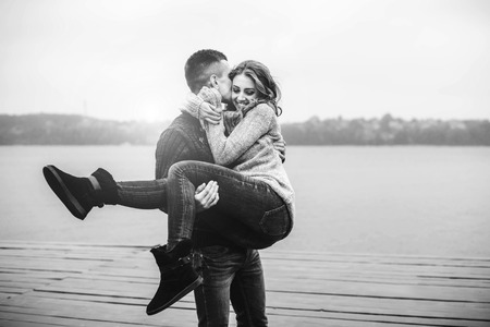 Young happy couple have fun outdoor in the parkの写真素材
