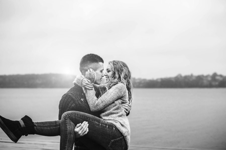 Young happy couple have fun outdoor in the parkの写真素材