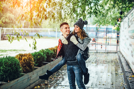 Young happy couple have fun in the parkの写真素材
