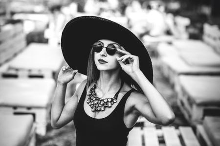 Young pretty sexy girl relaxing outdoor in black swimwearの写真素材