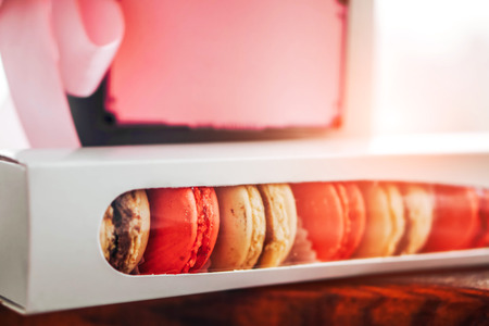 Colorful macaroons in the gift box with place for your textの写真素材
