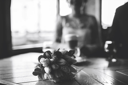 Happy wedding couple relaxing together in cafeの写真素材