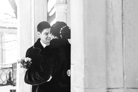 Happy young wedding couple walking outdoor togetherの写真素材