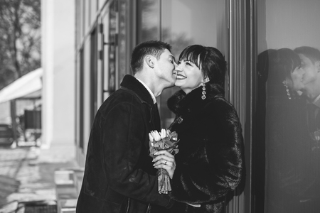 Happy young wedding couple walking outdoor togetherの写真素材