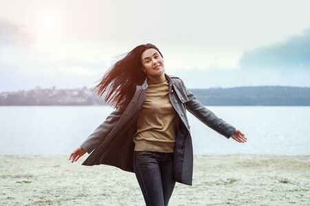 Young brunette woman walking outdoor in the parkの写真素材