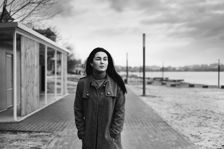 Young brunette woman walking outdoor in the parkの写真素材