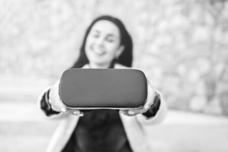 Brunette girl outdoor in VR glasses, black and whiteの写真素材
