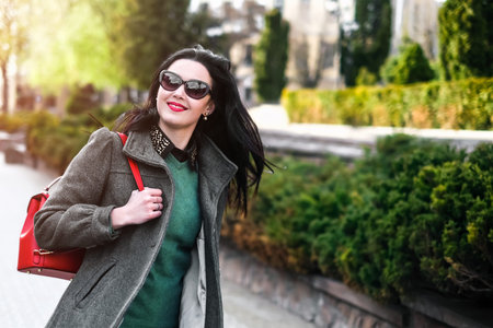 Woman with streaming hair outdoor on the streetの写真素材