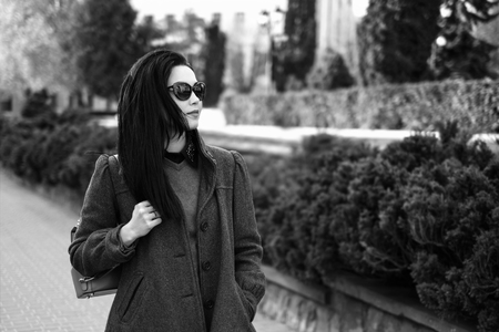 Woman outdoor on the street with backpack, black and whiteの写真素材