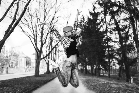 Pretty girl enjoy virtual reality glasses, black and whiteの写真素材