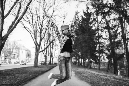 Pretty girl enjoy virtual reality glasses, black and whiteの写真素材