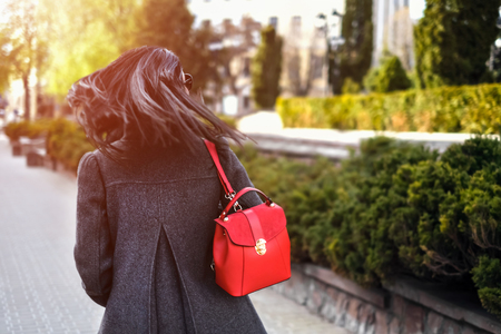 Woman with streaming hair outdoor on the streetの写真素材