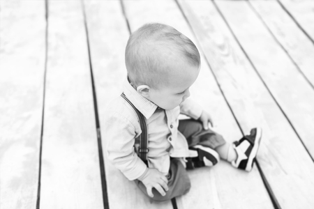 Cute little boy playing outdoor in the park, black and whiteの写真素材