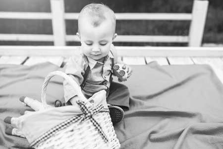 Cute little boy playing outdoor in the park, black and whiteの写真素材