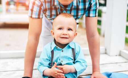 Young father with his little son have fun outdoor in the parkの写真素材