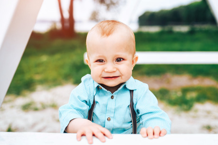 Cute little boy playing outdoor in the parkの写真素材
