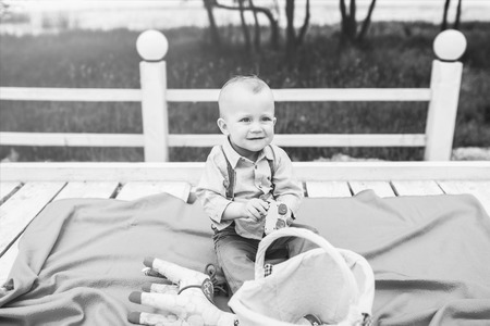 Cute little boy playing outdoor in the park, black and whiteの写真素材