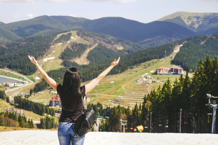 Tourist girl enjoy nature on the top of the mountainの写真素材