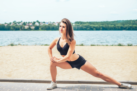 Pretty young brunette sporty girl workout outdoorの写真素材
