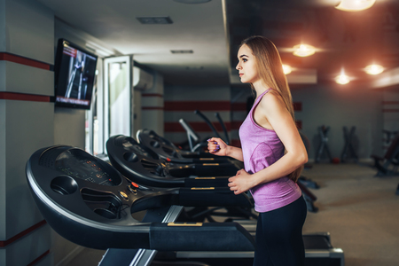 Pretty sporty girl training in the gymの写真素材
