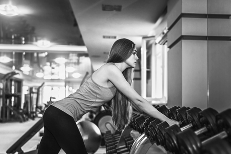 Pretty sporty girl training in the gymの写真素材