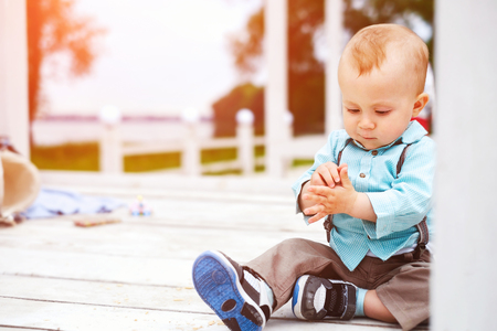 Cute little boy playing outdoor in the parkの写真素材