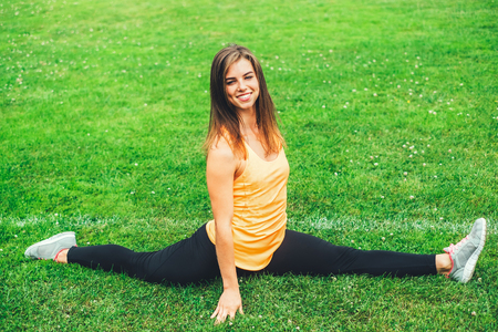 Pretty young brunette sporty girl workout outdoorの写真素材