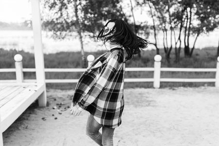 Pretty brunette girl have fun outdoor in the parkの写真素材