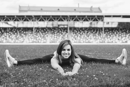Pretty young brunette sporty girl workout outdoor, black and whiteの写真素材