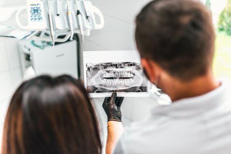 Dentist showing for the patient result of treatmentの写真素材
