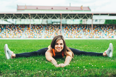 Pretty young brunette sporty girl workout outdoorの写真素材