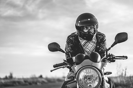 Biker on sport motorcycle outdoor on the roadの写真素材