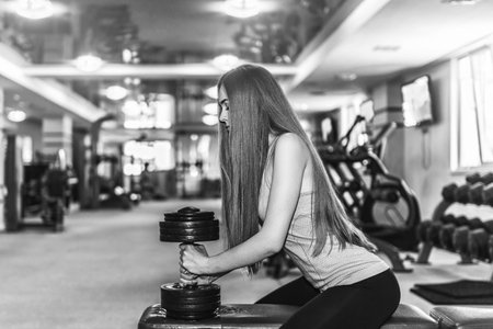 Pretty sporty girl training in the gymの写真素材