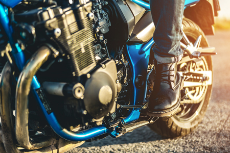 Biker on sport motorcycle outdoor on the roadの写真素材