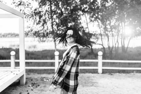 Pretty brunette girl have fun outdoor in the parkの写真素材